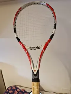 Babolat red and white tennis racket