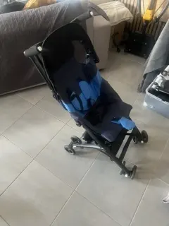 Lightweight foldable black and blue stroller with hood
