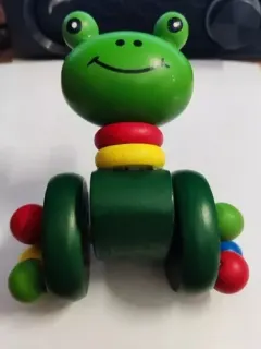 Coloured wooden pull-along frog on wheels for kids