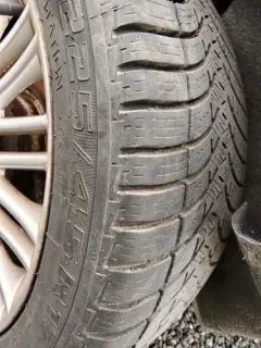 Used tire mounted on alloy rim