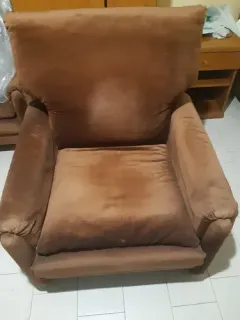 Brown faux leather padded armchair