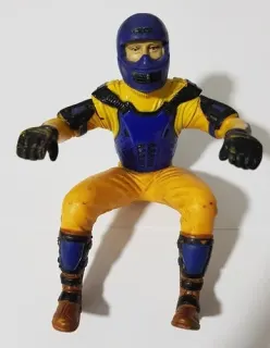 Vintage blue and yellow motorcyclist action figure