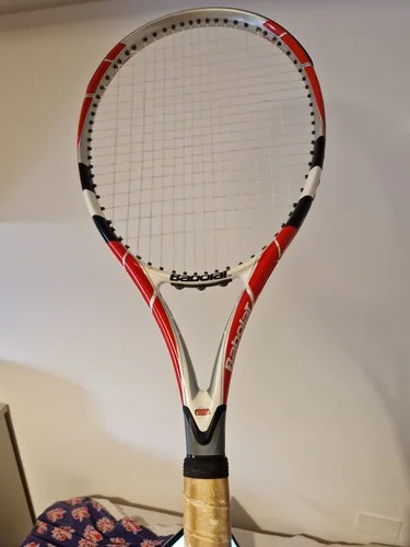 Babolat red and white tennis racket