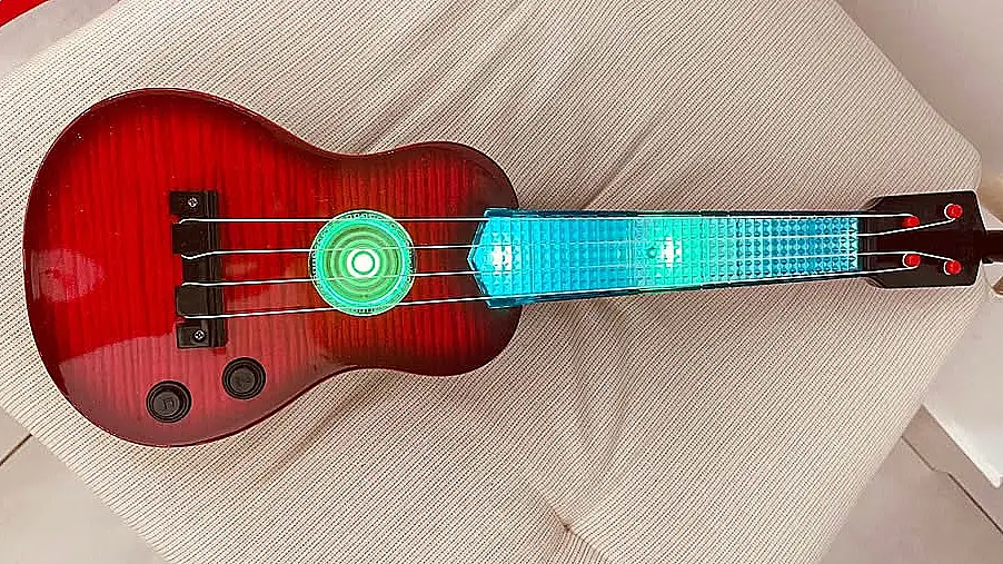 Guitare jouet rouge a manche lumineux