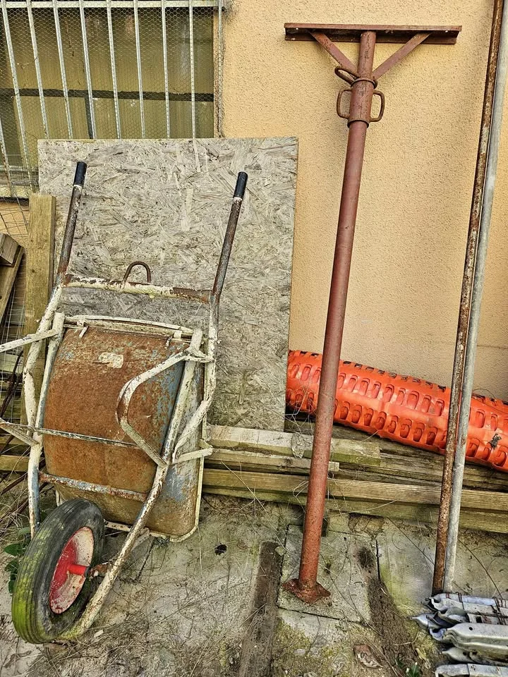 Wheelbarrow + OSB panel + adjustable steel props
