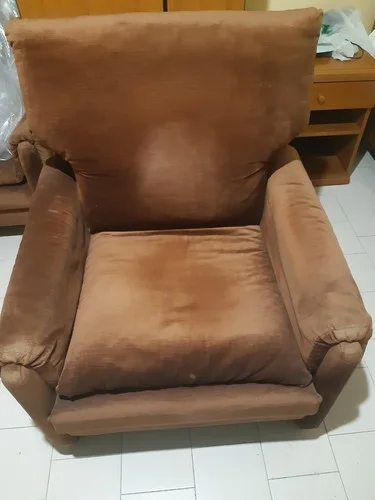 Brown faux leather padded armchair