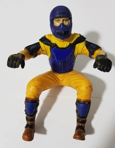 Vintage blue and yellow motorcyclist action figure